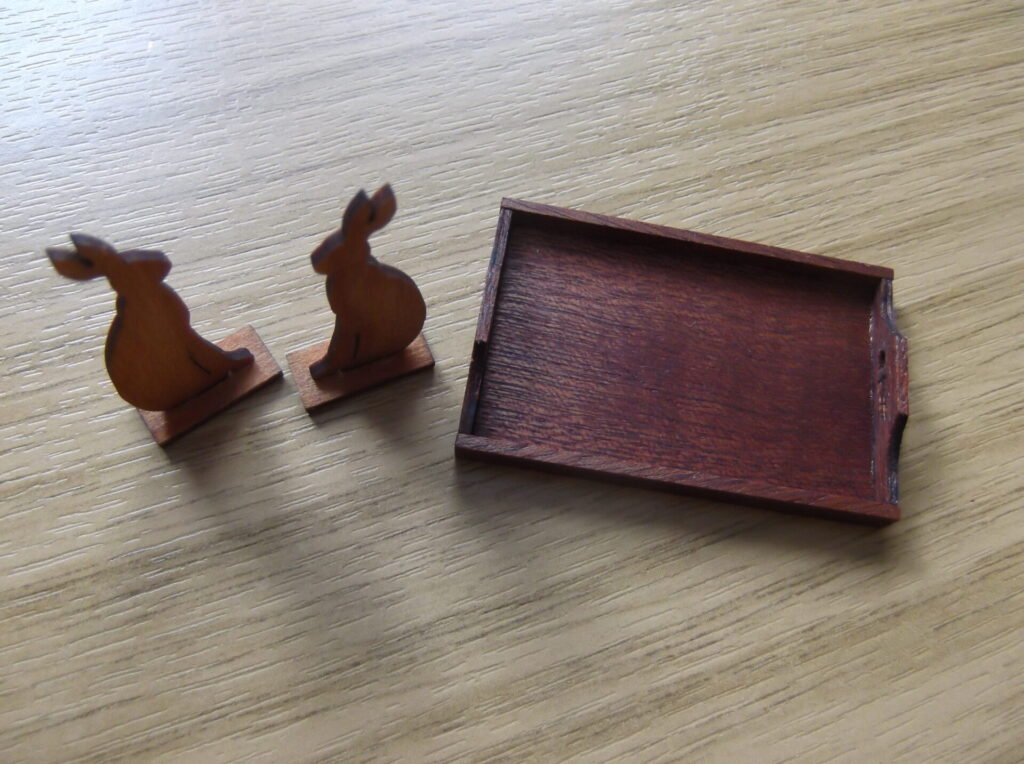 Doll's house hare bookends and a tray