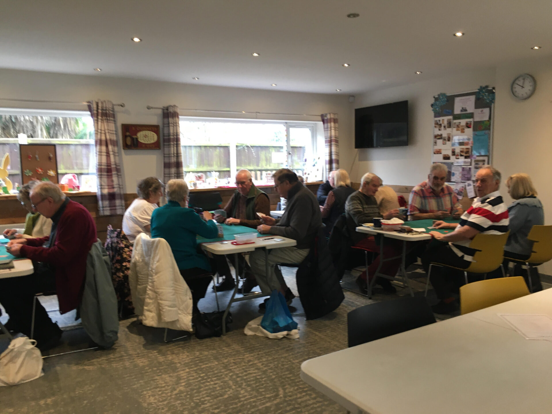 A group of people playing Canasta